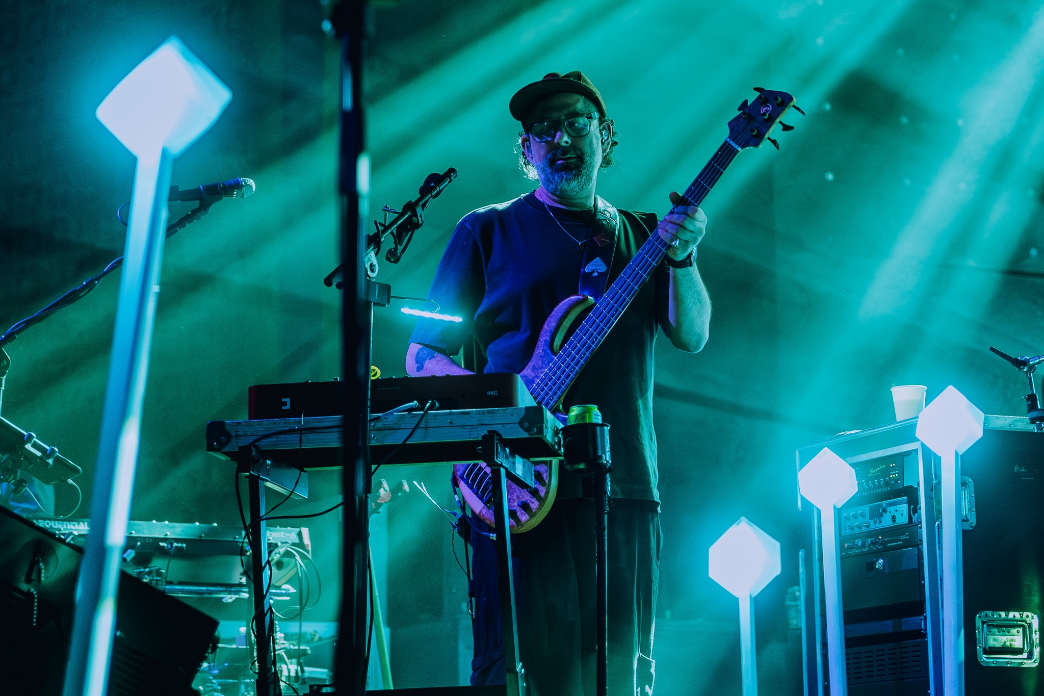 Musician playing bass guitar on stage