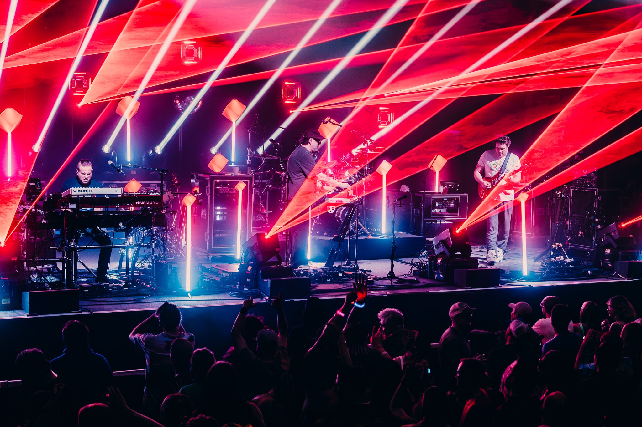 Live band performing neon stage concert