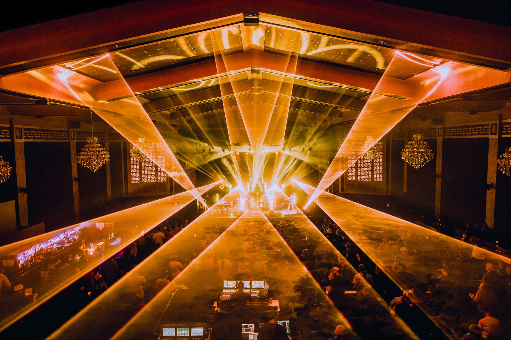 Concert venue with dramatic orange light beams
