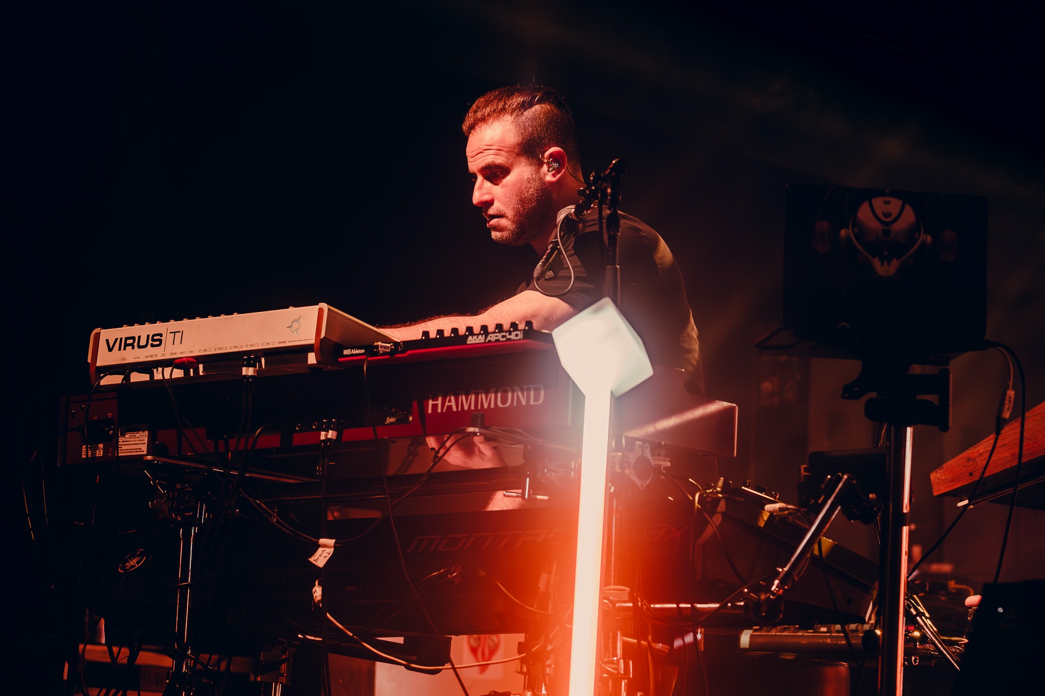 Musician performing with synthesizer on stage